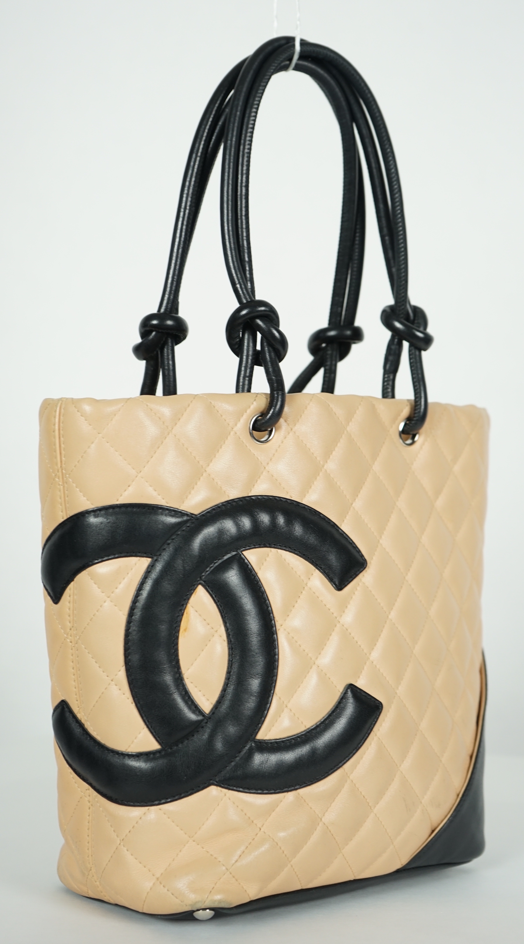 A Chanel Cambon Ligne black and beige quilted leather tote, width 26cm, height 24cm, overall height 40cm, depth 11cm, Please note this lot attracts an additional import tax of 20% on the hammer price